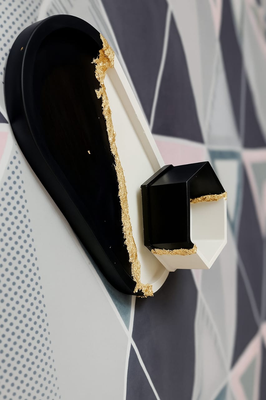 Black and white shoe with a geometric patterned background