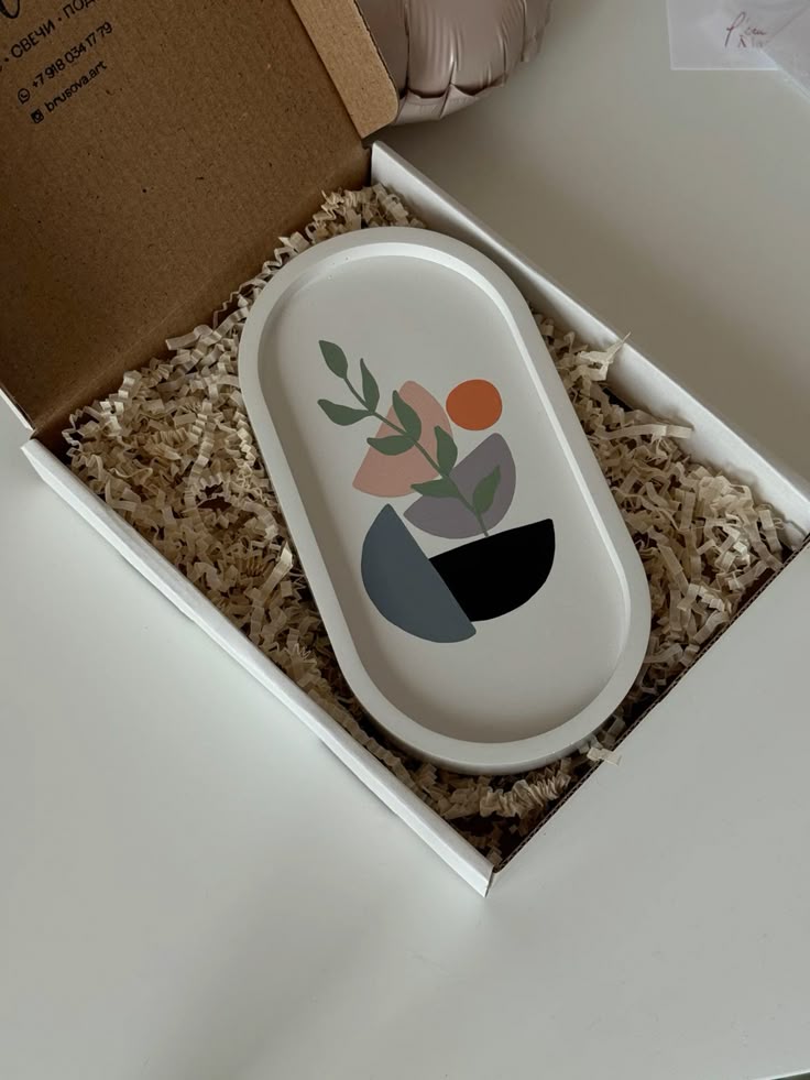 Decorative tray with floral design in a box