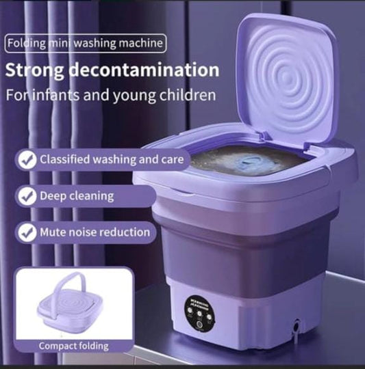 Purple folding mini washing machine with text highlighting features for infants and young children.